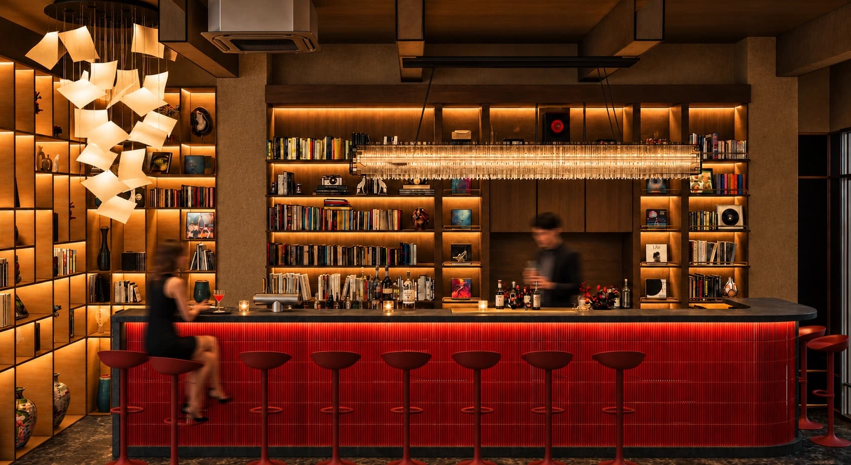 พื้นที่ภายใน Readio Bar พร้อมเคาน์เตอร์บาร์และชั้นหนังสือ
